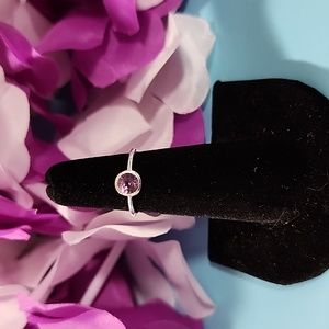 Size 5 Sterling Silver stamped 925 with Amethyst. All have been tested. NWOT